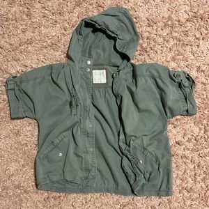 Hello! I am selling a jacket with a hood, half sleeves, and a zipper.